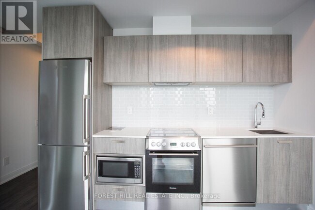 Building Photo - 50 Charles St E