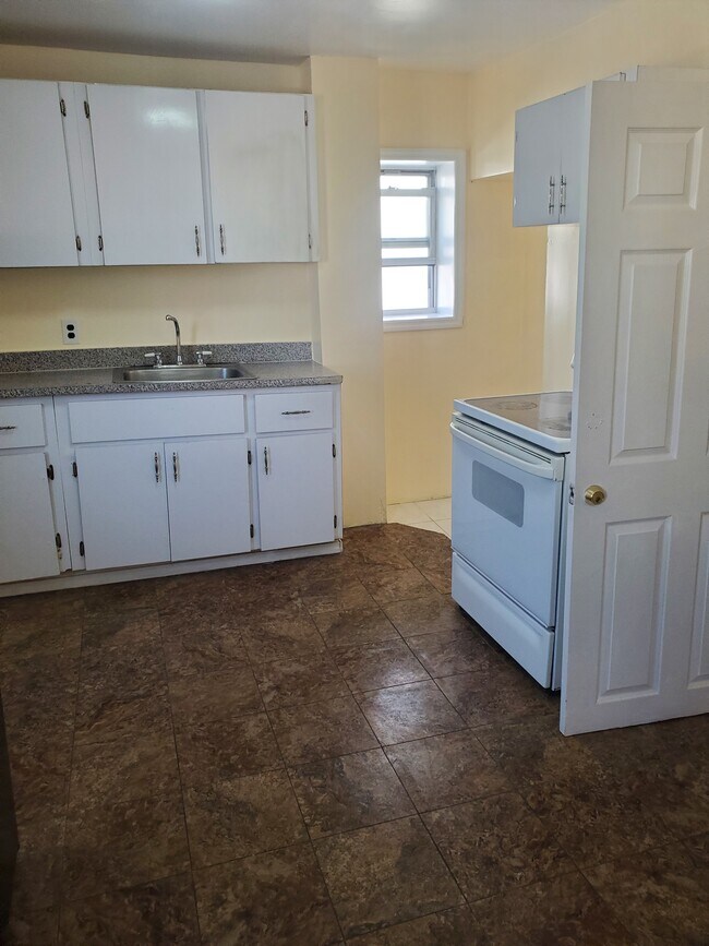 Kitchen with plenty of cabinets - 13872 Francis Lewis Blvd