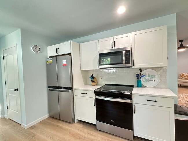 Building Photo - This FULLY FURNISHED ALL INCLUSVIE HOME IS...