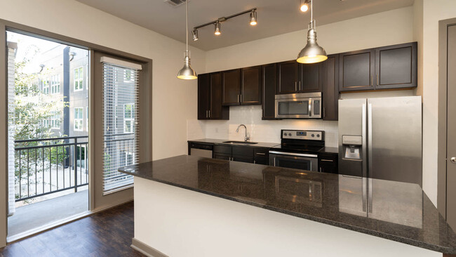 Kitchen with Stainless Steel Appliances - Crest at Park Central