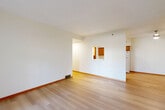 Located at 3464 Hampton Ridge Dr in Rockford, Illinois, this single-floor, 2-bedroom, 2-bathroom home offers a practical and comfortable layout. Light-toned hardwood-style flooring flows through the living room, dining room, and kitchen, creating a cohesive and airy feel throughout the main living areas. The living room is bright and welcoming, featuring a sliding glass door that fills the space with natural light and provides views of the outdoor greenery. A pass-through opening connects the living and dining areas to the kitchen, enhancing the open feel of the home. The galley-style kitchen is well-appointed with warm oak cabinetry extending to the ceiling for ample storage, white appliances including a refrigerator, range, and dishwasher, and a double sink with a clean countertop workspace. Both bedrooms are carpeted for comfort and include ceiling fans and mirrored sliding closet doors. The spacious primary bedroom offers generous square footage and easy access to the hallway. Two full bathrooms serve the home, each equipped with a tub-shower combination. Additional conveniences include a dedicated laundry area, multiple closets for storage, and an attached garage. The home presents a clean, functional design well-suited for comfortable everyday living.