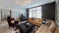 This single-floor residence at 168 Market St in Westlake, Ohio offers a thoughtfully designed layout with a contemporary aesthetic throughout. The kitchen is a standout feature, outfitted with dark espresso cabinetry contrasted by light quartz countertops, stainless steel appliances including a French door refrigerator, built-in microwave, and dishwasher, plus a stainless steel range hood. A peninsula with bar seating and pendant lighting above creates a natural transition into the dining and living areas, making it ideal for both everyday living and entertaining.

The living room is anchored by light wood-look flooring, a bold dark accent wall, and a contemporary track lighting fixture. Large windows allow generous natural light and outdoor views, contributing to an open, airy atmosphere. Sliding glass-panel doors connect seamlessly to adjacent spaces.

The bedrooms are carpeted for comfort, each featuring large windows with exterior views and neutral tones that create a calm, restful environment. The primary bedroom includes a spacious walk-in closet area with built-in shelving and direct access to a private bathroom with a glass-enclosed shower. An additional full bathroom features subway-style tile surrounding a soaking tub, with light wood-look flooring completing the clean, modern finish.