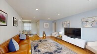 Located at 20 Foster Way, Unit 42 in Woodbridge, NJ, this well-appointed one-bedroom, one-bathroom unit offers a thoughtfully organized single-floor layout. Warm hardwood flooring flows throughout the main living areas, lending cohesion and a sense of warmth to the space.

The living room is bright and welcoming, featuring recessed lighting, a large window with sheer curtains that invite natural light, and soft blue accent walls that create a calm, modern ambiance. The space flows seamlessly into the dining area, which connects directly to the kitchen.

The kitchen is efficiently designed with warm wood cabinetry, granite-style countertops, a marble-look tile backsplash, stainless steel appliances, and light wood-style flooring. A cozy breakfast nook provides casual dining space within the kitchen itself, while a separate dining room offers additional flexibility.

The generously sized bedroom is a standout feature, highlighted by a bold blue accent wall, natural light from a large window, and rich hardwood flooring. Two closets provide ample storage throughout the unit.

The full bathroom is clean and functional, featuring tile flooring, a wood vanity with granite countertop, a mirrored medicine cabinet, and a glass-enclosed tub and shower combination with marble-style tile surround. A hallway connects the main areas, completing this efficient and stylish layout.