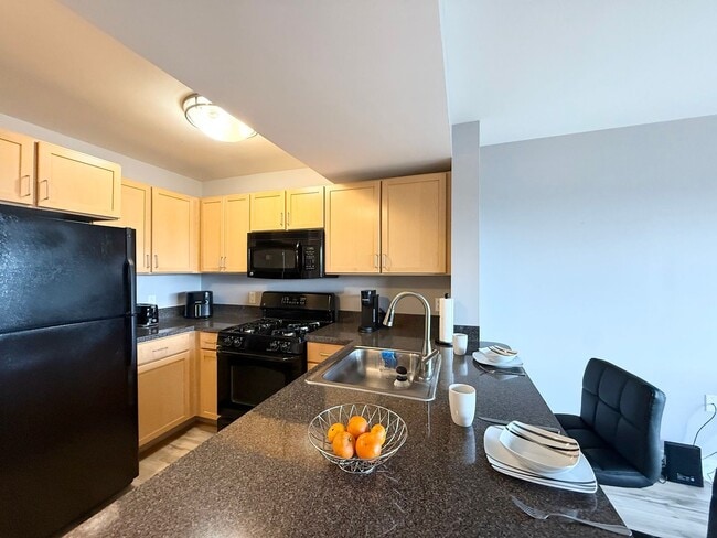 Building Photo - Utilities Included + Fully Furnished | Waterfront Studio That Lives Like a One-Bedroom | SW DC