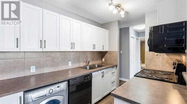 Photo du bâtiment - 110-124 24 Ave SW