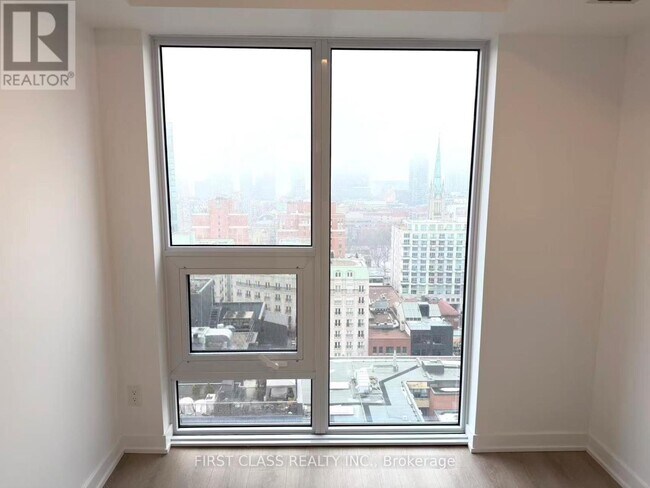 Building Photo - 100 Queen St E