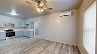 This 580 square foot apartment offers a thoughtfully designed living space with modern amenities. The single-story layout comprises one bedroom, one bathroom, and an open-concept living area. The kitchen is a standout feature, boasting a contemporary design with light-colored cabinetry, stainless steel appliances, and ample counter space. The L-shaped configuration maximizes functionality while maintaining an open feel.

The bedroom, measuring 140 square feet, provides a comfortable retreat with large windows allowing natural light to flood the space. A ceiling fan adds both style and practicality. The bathroom, though not pictured, is conveniently located and likely features updated fixtures to match the overall modern aesthetic of the apartment.

Throughout the apartment, light-toned wood-look flooring creates a sense of continuity and enhances the perception of space. The neutral color palette on the walls contributes to a bright and airy atmosphere. Climate control is ensured through a combination of ceiling fans and a wall-mounted air conditioning unit.

Additional amenities include a separate laundry area and a closet for storage, both essential in maximizing the functionality of this compact living space. The hallway efficiently connects all areas of the apartment, ensuring easy navigation throughout.

Located at 5339 US-319 S in Thomasville, GA, this apartment offers a blend of modern living and efficient design, ideal for those seeking a contemporary, low-maintenance lifestyle in a well-appointed space.