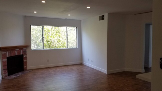 Living room with gas fireplace - 14126 Tiara St