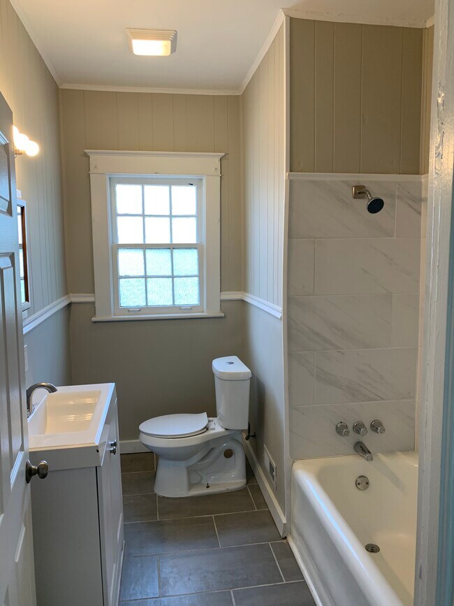 Updated Bathroom with Tile Shower - 1520 36th St N