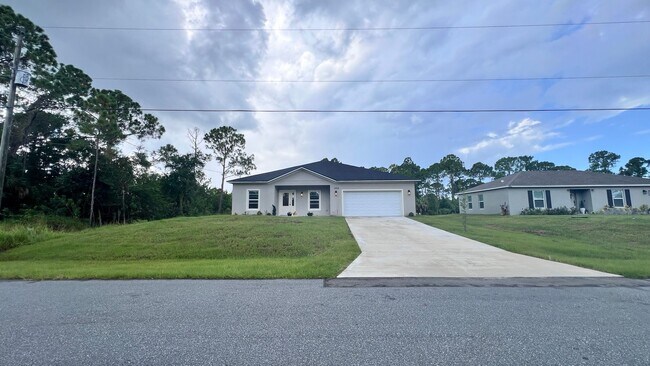 Building Photo - WONDERFUL 4 BD/2BA Home in Beautiful Palm ...