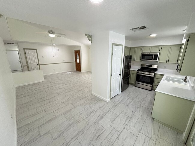 Building Photo - This inviting single-story home boasts a s...