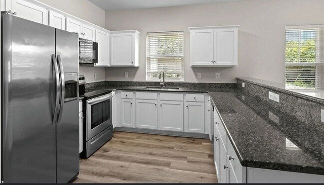 Building Photo - First Floor Comfort Meets Picture Perfect Pond Views