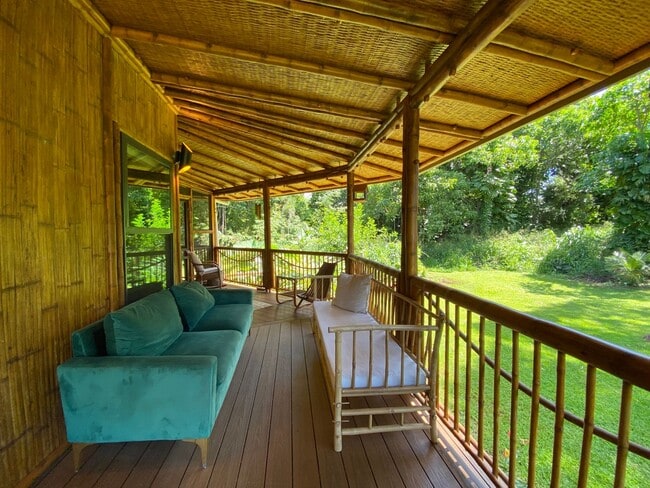 Building Photo - For Rent: Custom Bamboo Home with Lush Garden Setting