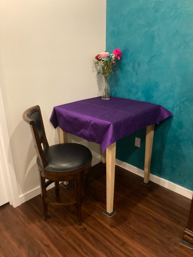 There are two bar-height tables/desks perfect for standing or sitting. - 2830 Chadwick Cir