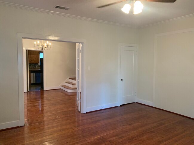 living room facing dining room with closet under stairs - 1632 Kipling St