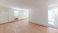 Located at 319 Whites Rd in Lansdale, PA, this well-appointed two-bedroom, one-bathroom unit offers a comfortable and functional single-floor layout. The open living area is bright and welcoming, finished with light hardwood flooring and crisp white walls that maximize the sense of space. Multiple windows allow natural light to flow throughout, with views of surrounding greenery adding a pleasant outdoor connection. A ceiling fan in the living area adds to the comfort of the space.

The kitchen is thoughtfully appointed with white shaker-style cabinetry, granite-look countertops, a stainless steel refrigerator, dishwasher, and sink — providing both style and practicality for everyday living.

Both bedrooms are carpeted for warmth and comfort. The generously sized primary bedroom includes a closet and window with natural light, while the second bedroom offers a quiet, versatile space suitable for a guest room or home office. Each room features baseboard heating.

The bathroom is a standout feature, showcasing a full tub-shower combination adorned with large-format marble-style tiles in white and grey tones, lending an elegant, clean aesthetic. Overall, the unit presents a fresh, move-in-ready environment in a convenient Lansdale location.