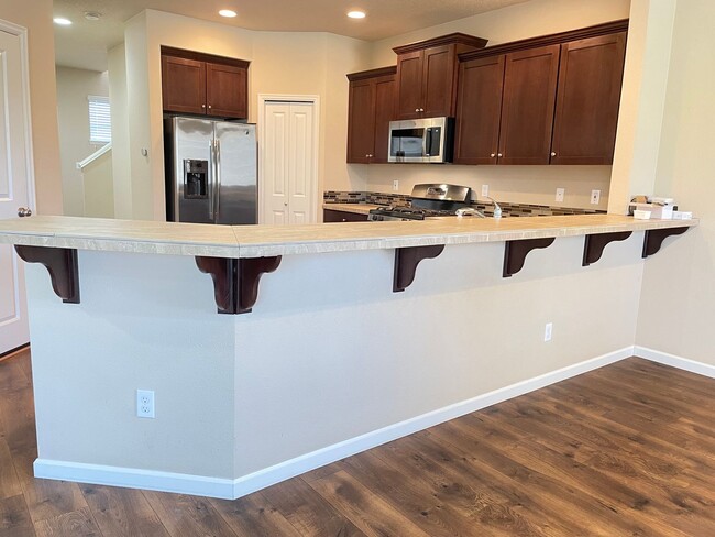 Building Photo - Spacious 4-Bedroom Home with Inviting Curb...