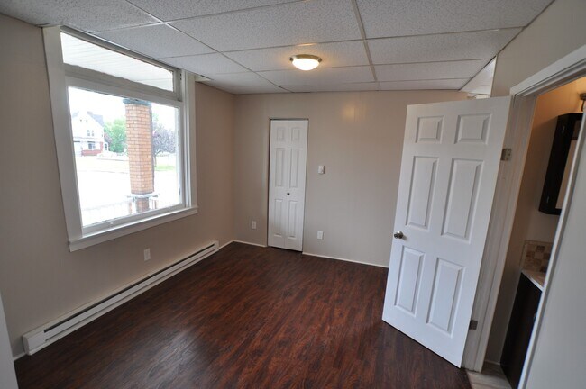 Building Photo - Spacious and Charming Efficiency Apartment...