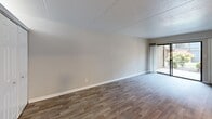 Located at 600 E Inskip Drive in Knoxville, Tennessee, this one-bedroom, one-bathroom unit offers a practical and well-organized single-floor layout. Wood-look plank flooring runs throughout the home, providing a consistent and clean aesthetic from room to room.

The living room is a comfortable, open space finished with neutral gray walls and crisp white trim. A sliding glass door fills the room with natural light and provides access to the outdoors. The bedroom is a generously sized retreat featuring a ceiling fan with light fixture and a horizontal clerestory window that brings in additional natural light while maintaining privacy. A closet with a panel door adds functional storage.

The kitchen is outfitted with white cabinetry, dark countertops, a subway tile backsplash, a stainless steel sink, and a black dishwasher. A horizontal window above the counters allows natural light into the space. The bathroom features a full tub and shower combination with white tile surround, a built-in niche shelf, and a toilet — offering a clean, functional design.

A hallway connects the rooms efficiently, and the neutral color palette used throughout the unit creates a cohesive and move-in-ready atmosphere. The overall layout makes smart use of the available space, making this unit a practical option in the Knoxville area.