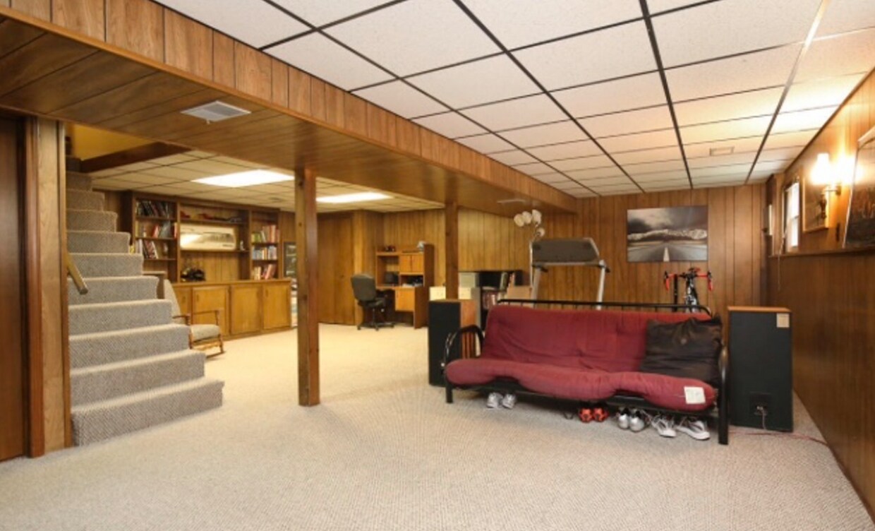 Basement has been updated. Grey walls and newer carpet. - 225 Ivanhoe Ave NE
