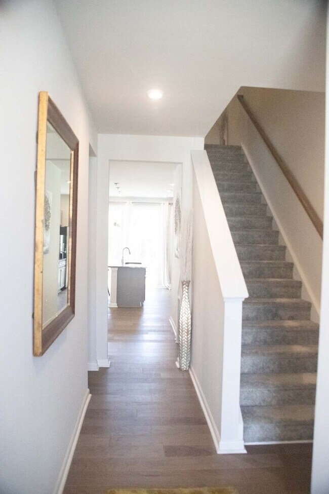 Building Photo - Introducing a one-year-old end unit townhome