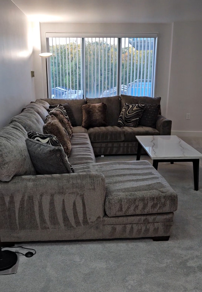 sectional/sleeper couch and coffee table - 10201 Grosvenor Plz Apartment