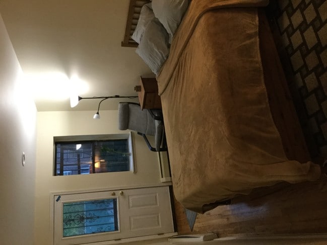 Brown bedroom w/ backyard access - 507 W 173rd St