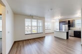 Located at 11516 Old Wadsworth Blvd in Broomfield, Colorado, this well-appointed 3-bedroom, 2-bathroom single-floor residence offers a thoughtfully designed open-concept layout. The living and kitchen areas flow seamlessly together, bathed in natural light from multiple windows with horizontal blinds that frame views of the surrounding area. Light wood-look flooring runs throughout the main living spaces, adding warmth and continuity.

The kitchen is a standout feature, boasting rich dark-espresso cabinetry that reaches toward the ceiling, granite countertops, a central island with additional counter space, stainless steel appliances including a French door refrigerator, built-in microwave, and range, plus track lighting overhead. The open design allows easy interaction between the kitchen and living room.

The three bedrooms offer a comfortable retreat; two are finished with plush carpet flooring, while at least one features hardwood-style flooring and direct access to an in-unit stacked washer and dryer. Each room is brightened by windows with outdoor views.

Both bathrooms are finished consistently with dark vanity cabinetry, granite countertops, undermount sinks, and tiled tub-shower combinations. The clean, neutral palette throughout creates a cohesive and modern ambiance across the entire residence.