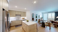 This well-designed single-floor home in Murrieta, CA offers three bedrooms, two bathrooms, and a thoughtful layout that balances functionality with modern style. Light wood-tone flooring flows throughout, tying together the open-concept living and dining areas. The living room features clean white walls, natural light from a glass door, and a welcoming atmosphere ideal for everyday living and entertaining.

The kitchen is a standout space, outfitted with flat-front light wood cabinetry extending to the ceiling, white quartz countertops, a tile backsplash, stainless steel appliances, and a central island with seating — perfect for casual dining or meal prep.

The primary bedroom is generously sized, with windows that bring in natural light and views of the surrounding area, a ceiling fan, and direct access to a walk-in closet featuring built-in shelving and hanging rails. The secondary bedrooms are equally bright, each with windows and neutral finishes.

Both bathrooms are clean and functional, featuring tub-shower combinations with tile surrounds, wood-tone flooring, and white vanities. The second bathroom also includes built-in open shelving for added storage.

A dedicated entrance and hallway connect the spaces seamlessly, completing this comfortable and move-in-ready home.