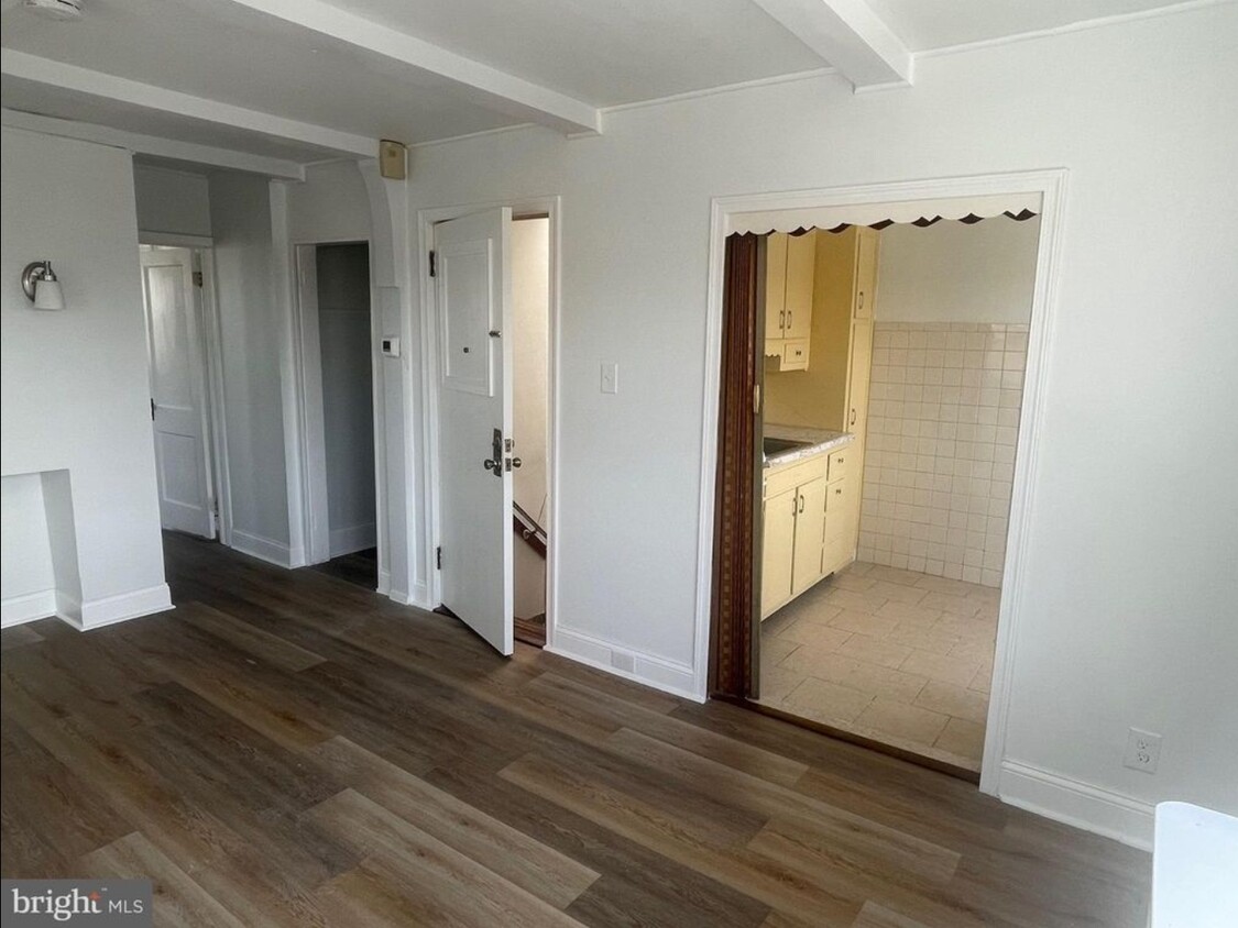 2nd Flr Living room facing entrance, kitchen, and bedroom hallway - 3947 Claridge St