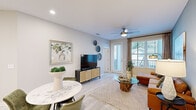 This thoughtfully designed 1-bedroom, 1-bathroom residence offers a smart, efficient layout across a single floor. The open-concept kitchen and living area forms the heart of the home, where the kitchen stands out with gray shaker-style cabinetry, white quartz countertops, a subway tile backsplash, stainless steel appliances including a French door refrigerator, built-in microwave, and dishwasher, plus a central island with seating. Light wood-style flooring flows seamlessly throughout, creating a cohesive, airy feel. The living room features a distinctive sage-green accent wall, a ceiling fan, and large windows paired with a glass door that opens to a private balcony, filling the space with natural light. The spacious bedroom accommodates a full suite of furniture comfortably, offering dual windows with plantation shutters, a ceiling fan, and direct access to the bathroom. The bathroom is finished with a gray vanity, white countertop, a full tub-shower combination, and wood-look tile flooring. A hallway connects the main living areas, completing this well-planned and stylishly finished residence.
