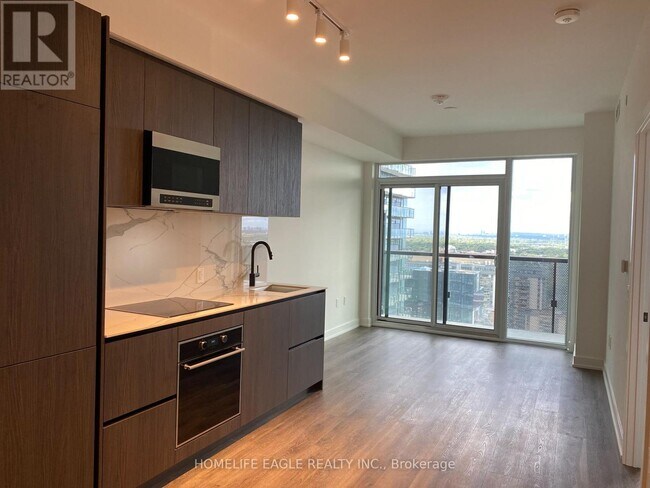 Photo du bâtiment - 117-3117 Broadway Ave