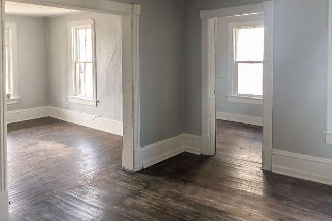 Large secondary room looking into bedroom. - 322 Beaser Ave