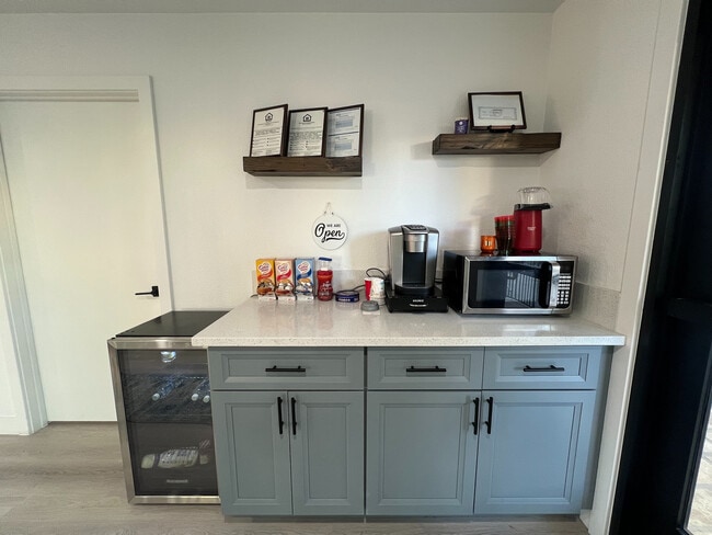 Explore this sleek kitchenette layout perfect for compact living. - Madison Green Valley