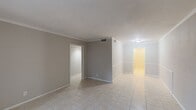 This single-story residence offers 870 square feet of efficiently designed living space. The home features three bedrooms, including a 150 square foot primary bedroom, and two bathrooms. The open-concept floor plan showcases a spacious living room that seamlessly connects to the kitchen area, creating a cohesive and functional space for daily living and entertaining.

The kitchen is equipped with white cabinetry and granite countertops, providing ample storage and preparation space. Large windows throughout the home allow for abundant natural light, enhancing the sense of openness and creating a bright, airy atmosphere. Neutral-toned walls and tiled flooring contribute to the contemporary aesthetic and offer a versatile backdrop for various decor styles.

Bedrooms are comfortably sized, with the primary bedroom offering a generous 150 square feet of space. Each room features a window, ensuring good ventilation and natural illumination. The bathrooms are fitted with modern fixtures, including a bathtub in at least one of them.

The home's compact yet thoughtful design maximizes the use of available space, making it an ideal choice for those seeking a low-maintenance lifestyle without compromising on comfort or functionality. Its single-story layout also enhances accessibility and ease of movement throughout the residence.