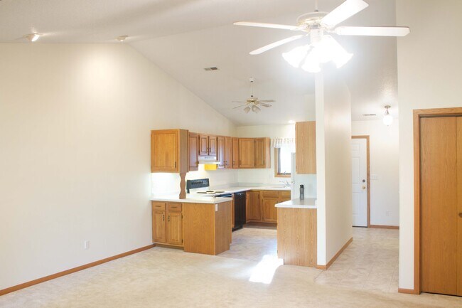 Open space kitchen, living room, dining room with cathedral ceiling. - 328 Cayman St