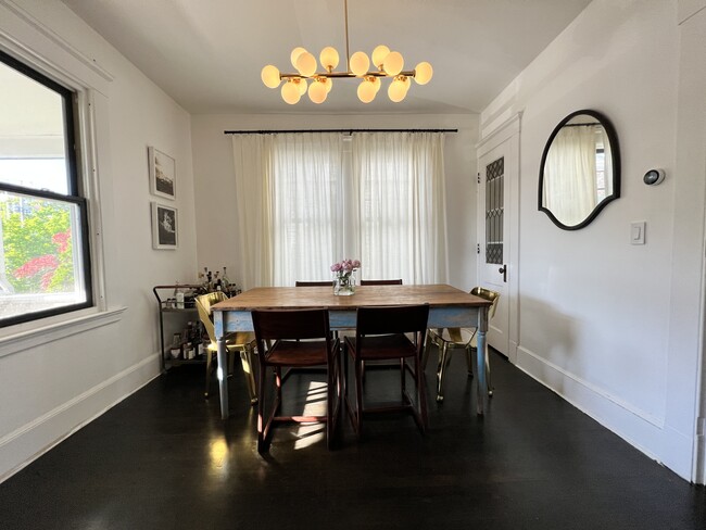 Dining room with hardwood floors and original built in cabinet. - 608 Central Ave