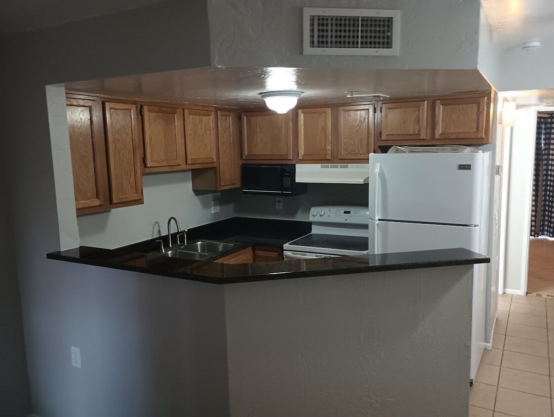 Kitchen from living room area - 12221 W Bell Rd