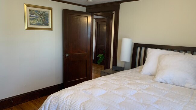 Furnished Bedroom with closet, dresser, lamp, and full length mirror - 12 Homer St
