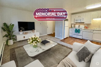2 BR, 1 BA - Living Room - The Stapleton Apartments