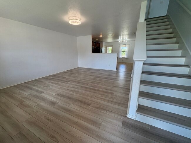 Front door opens to downstairs living room - 4208 SW Fieldstone Blvd