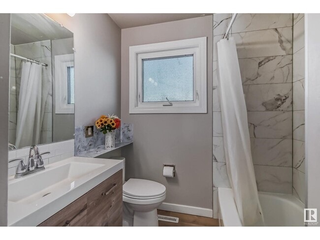 Building Photo - 6124-6137 137 Ave NW