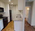 Located at 532 Broadway in El Cajon, this single-story unit offers a practical and well-organized layout designed for comfortable everyday living. The main living area features a combination of plush carpeting and wood-style flooring, creating a clear visual distinction between the lounge and dining zones. A ceiling fan overhead adds both function and a finished look, while a front entry door with a security panel provides convenient access. Natural light filters in through a sliding glass door fitted with vertical blinds, brightening the carpeted living space.

The galley-style kitchen is efficiently designed, offering granite-patterned countertops, white cabinetry, a double-basin sink, and black appliances including a range and refrigerator. Wood-style flooring continues through this space, contributing to a cohesive feel.

The bedrooms are carpeted and feature ceiling fans, with one room including a walk-in closet with built-in shelving and a window with vertical blinds for natural light. An additional carpeted room offers flexible use as a bedroom or secondary space.

The bathroom is appointed with a granite-topped vanity, white cabinetry, a well-lit mirror with globe lighting, and a full tub-shower combination, delivering a clean and functional finish throughout.