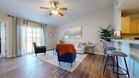 Located at Soldiers Drive in Findlay, Ohio, this single-story residence offers a well-designed, open layout that maximizes both comfort and functionality. The living room serves as the heart of the home, featuring rich hardwood-style flooring, vaulted ceilings, and a ceiling fan that adds to the airy feel of the space. A large sliding glass door floods the room with natural light and provides views of the surrounding landscape, creating a bright and welcoming atmosphere throughout.

The kitchen is designed for practicality and style, showcasing warm maple cabinetry, light countertops, a stainless steel dishwasher, and a double sink. It opens seamlessly toward the living area, reinforcing the home's open-concept flow. A dedicated home office off the main living space features hardwood-style flooring, a large window for natural light, and ample room for a full workstation setup.

The primary bedroom is a comfortable retreat, with plush carpeting, a ceiling fan, and a window offering outdoor views. It connects to a generous walk-in closet with built-in shelving and hanging storage. The bathroom includes a full tub and shower combination with clean, bright finishes. Throughout the home, neutral tones and consistent design details create a cohesive, move-in-ready living environment.