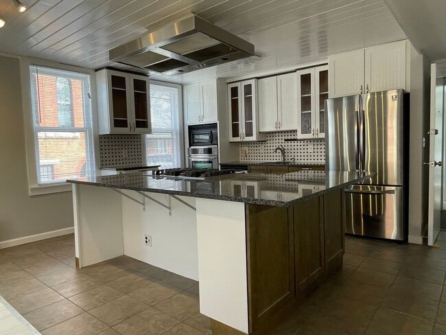Building Photo - Small pets are welcome with an additional ...