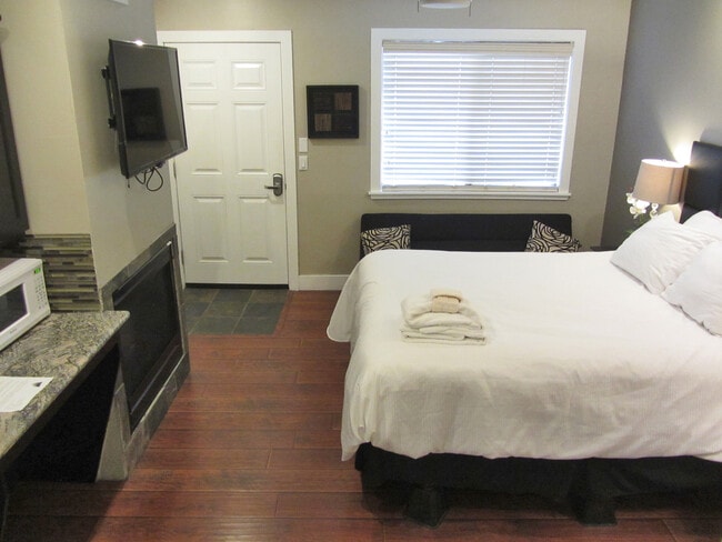 Bed and living area - 4069 Cedar Ave