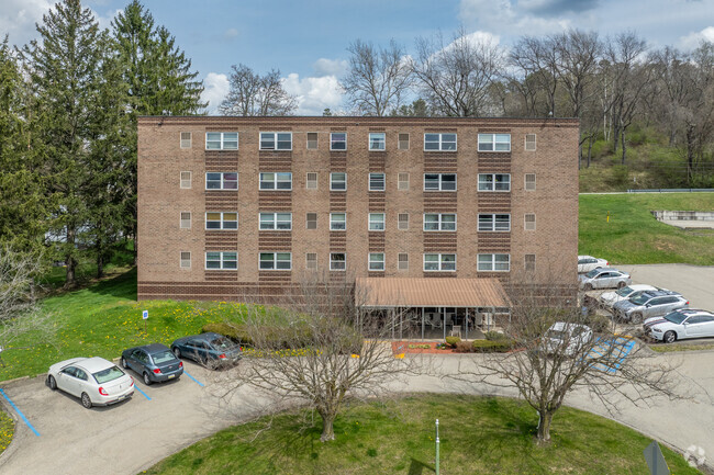 Building Front With Entrance and Parking - Ellsworth Parkview Apartments