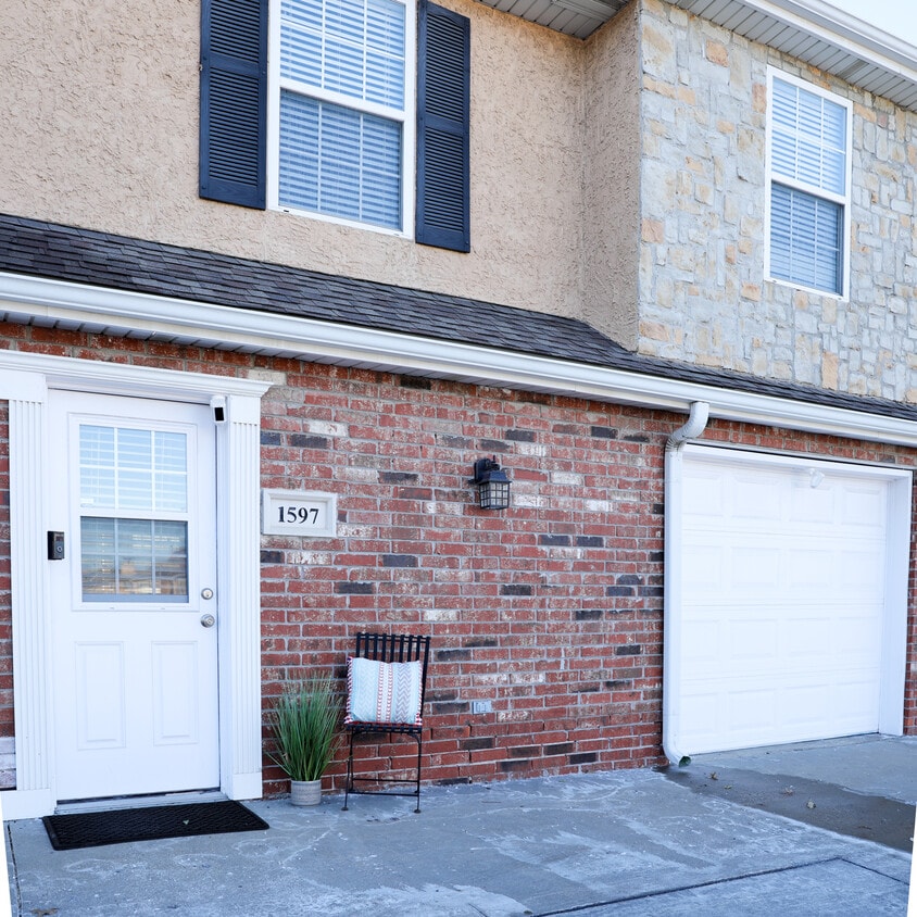 Condo entrance and attached garage - 1597 E 120th St