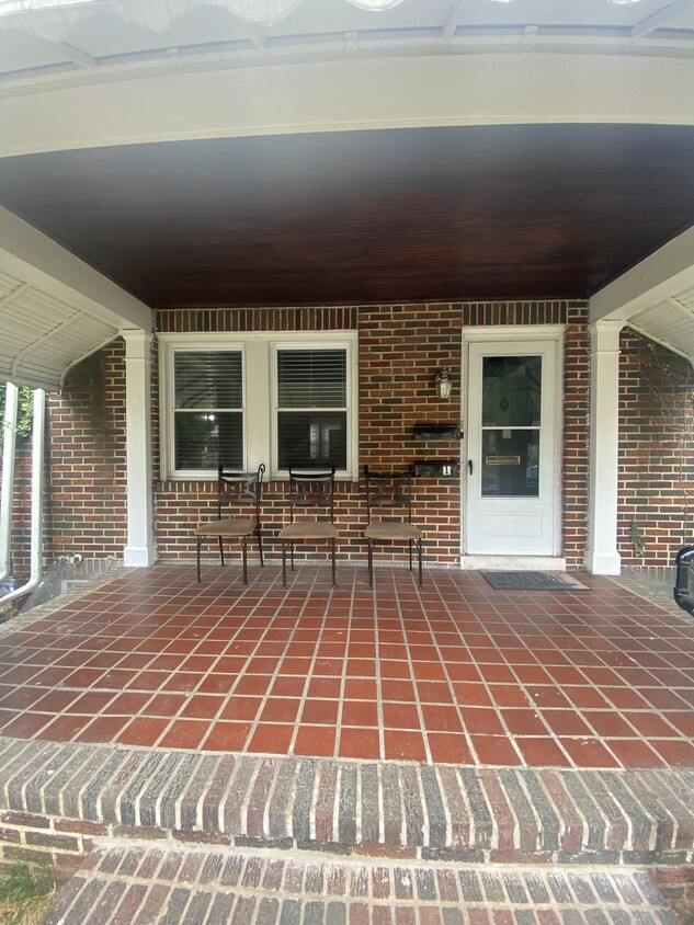 Front porch and entry through fenced in gate entry - 606 N Woodington Rd