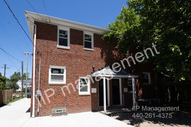 Building Photo - Make this beautiful brick colonial duplex ...